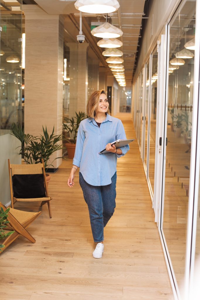Business lady walking through office